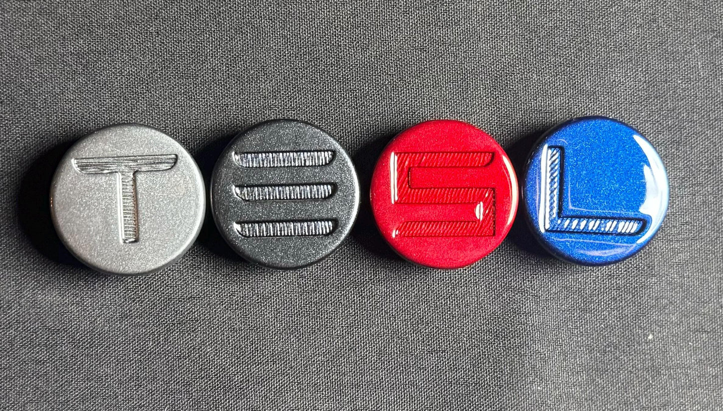 "T" in Quicksilver
"E" in Midnight Silver*
"S" in Ultra Red
"L" in Deep Blue

*Stealth Grey and Midnight Silver look very similar